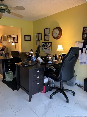 a view of a dining room with furniture wooden floor and chandelier