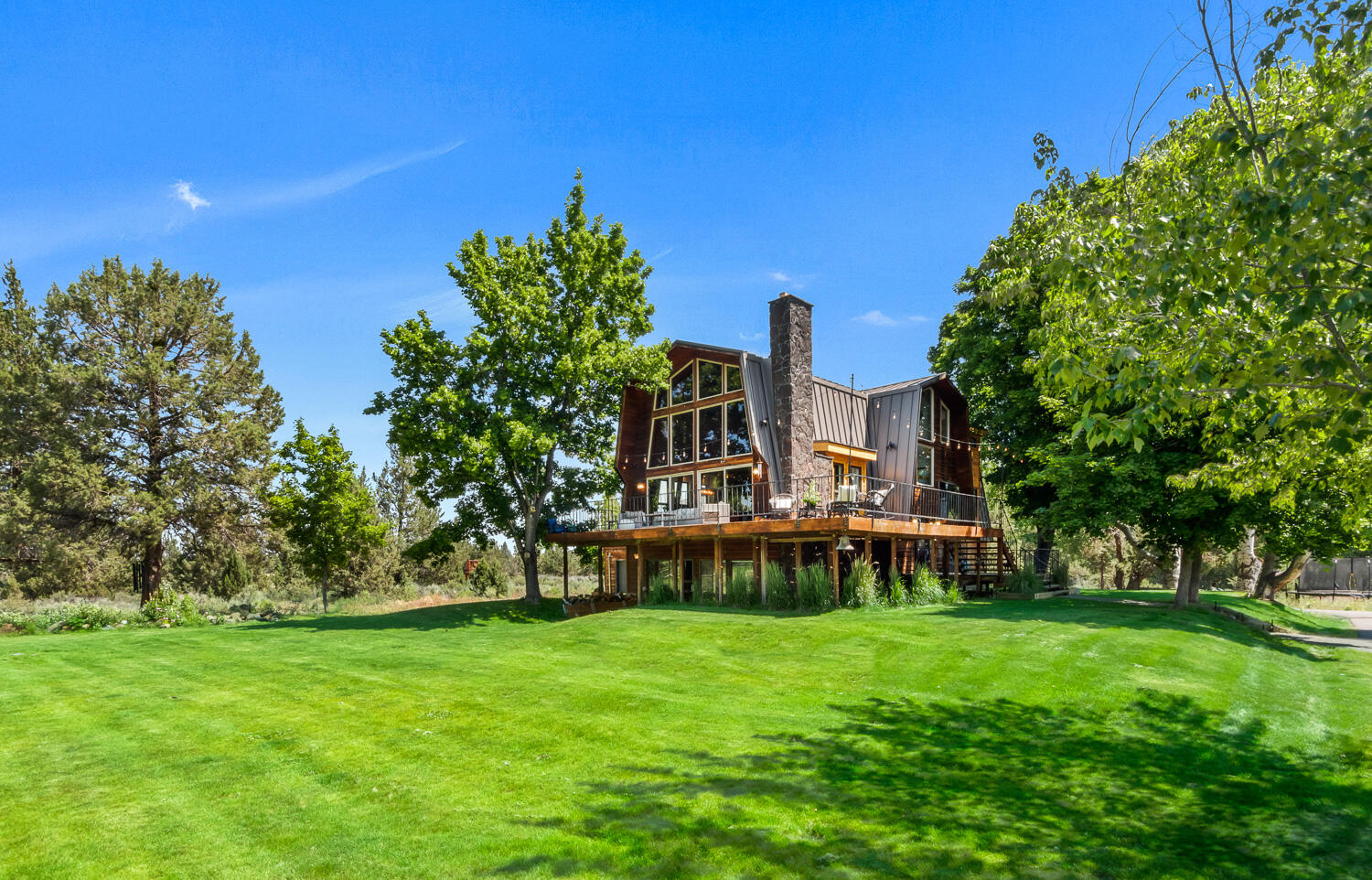 18970 Pinehurst Road Bend, OR 97703 - Photo 2 of 43 a view of a house with a backyard