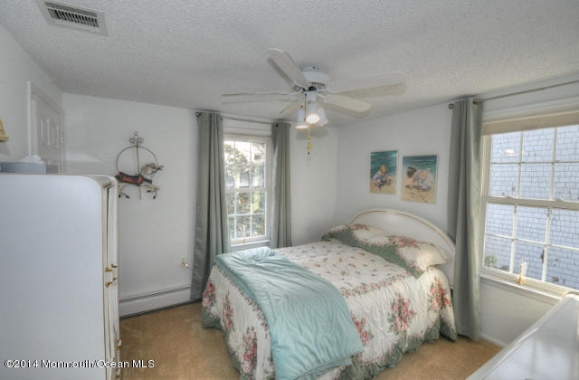 207 Allen Road Bayville, NJ 08721 - Photo 11 of 29 a bedroom with a bed and a window