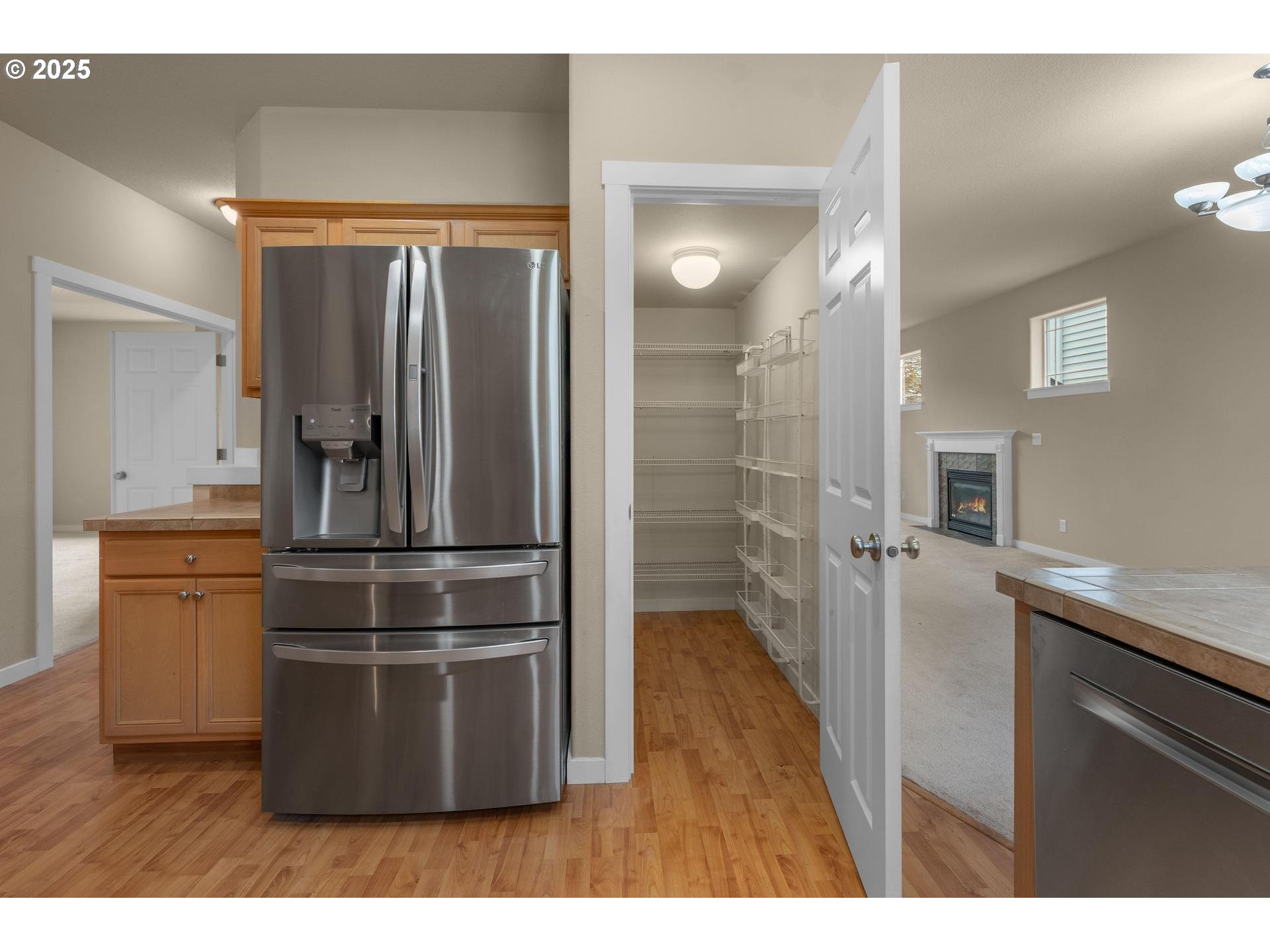 10797 Southwest Washington Street Portland, OR 97225 - Photo 14 of 48 a kitchen with stainless steel appliances granite countertop a refrigerator and a sink