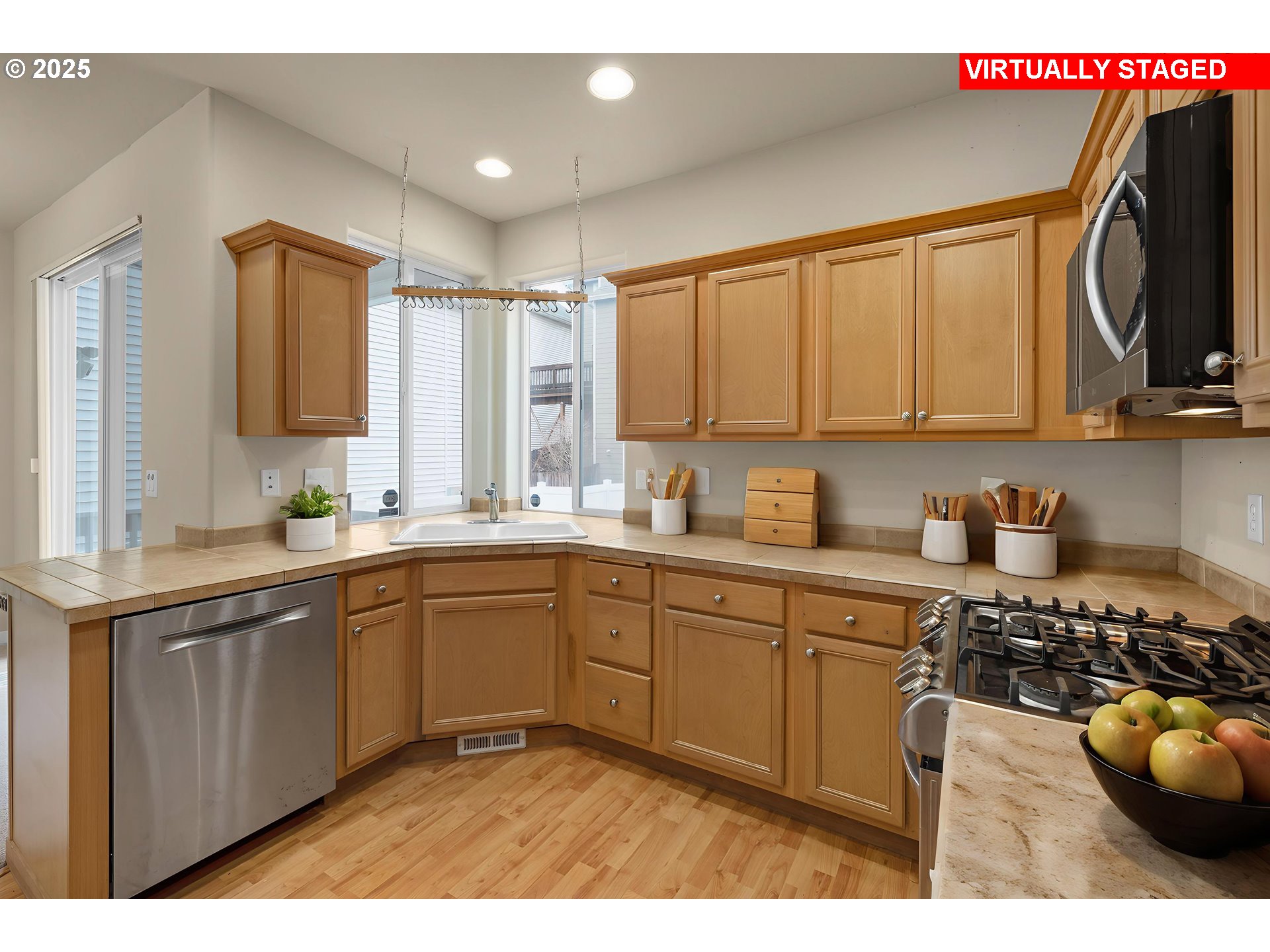 10797 Southwest Washington Street Portland, OR 97225 - Photo 16 of 48 a kitchen with a sink cabinets and window