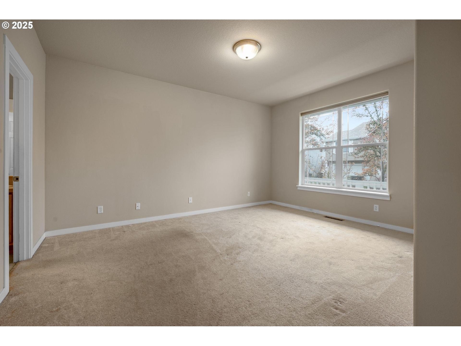 10797 Southwest Washington Street Portland, OR 97225 - Photo 19 of 48 a view of an empty room with a window
