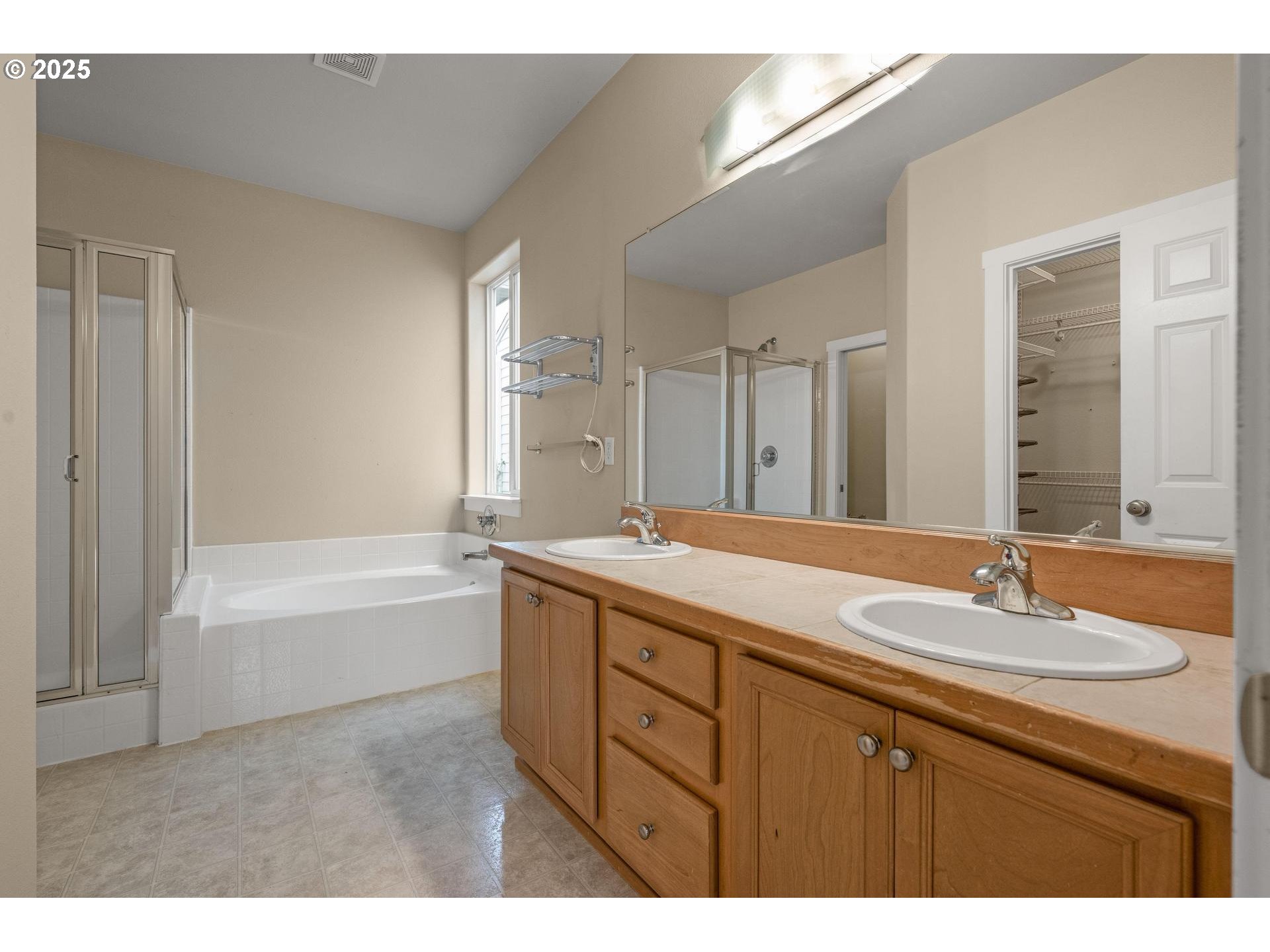 10797 Southwest Washington Street Portland, OR 97225 - Photo 21 of 48 a bathroom with a tub double sink and mirror