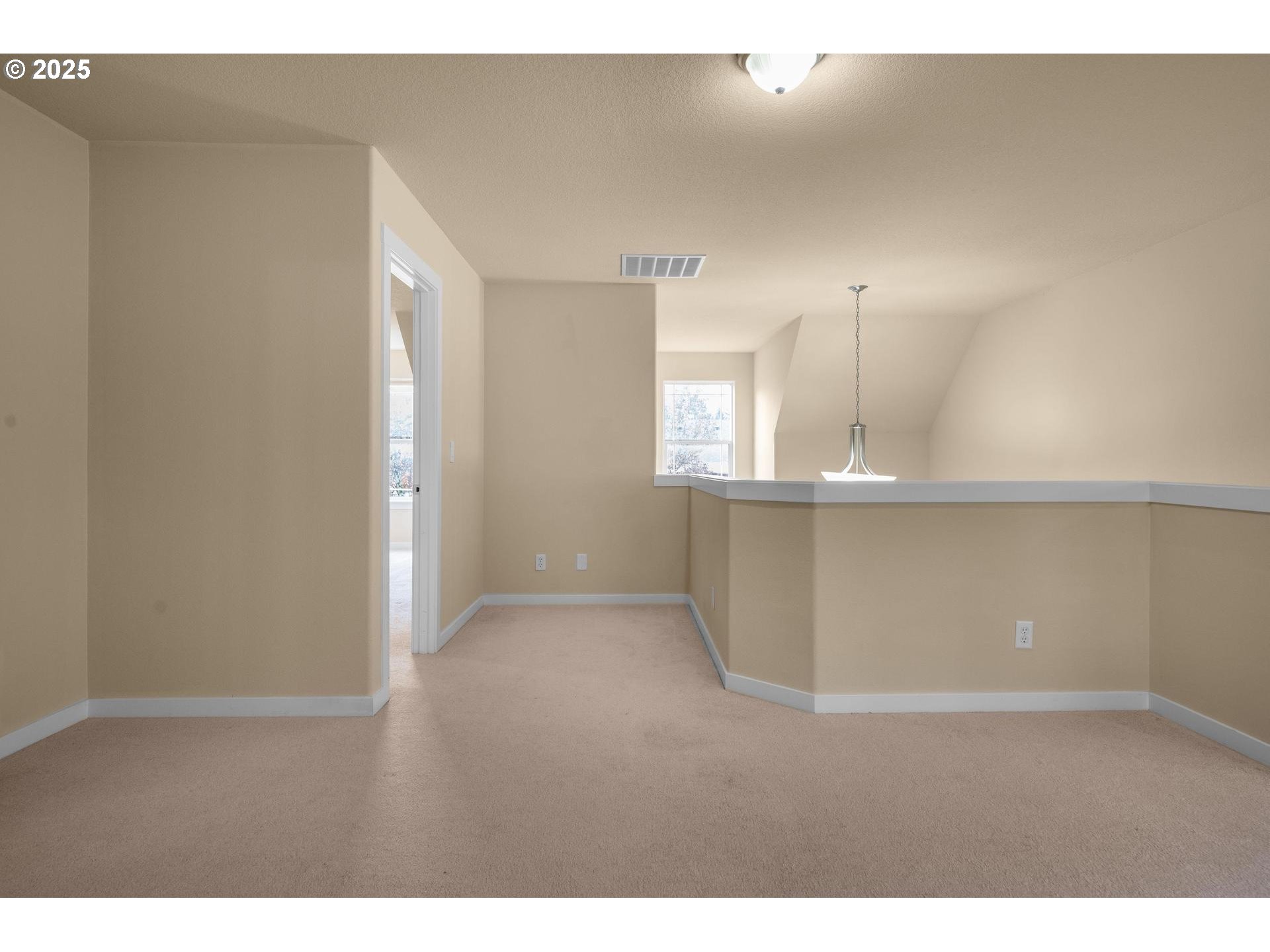 10797 Southwest Washington Street Portland, OR 97225 - Photo 42 of 48 a view of kitchen and empty room with wooden floor