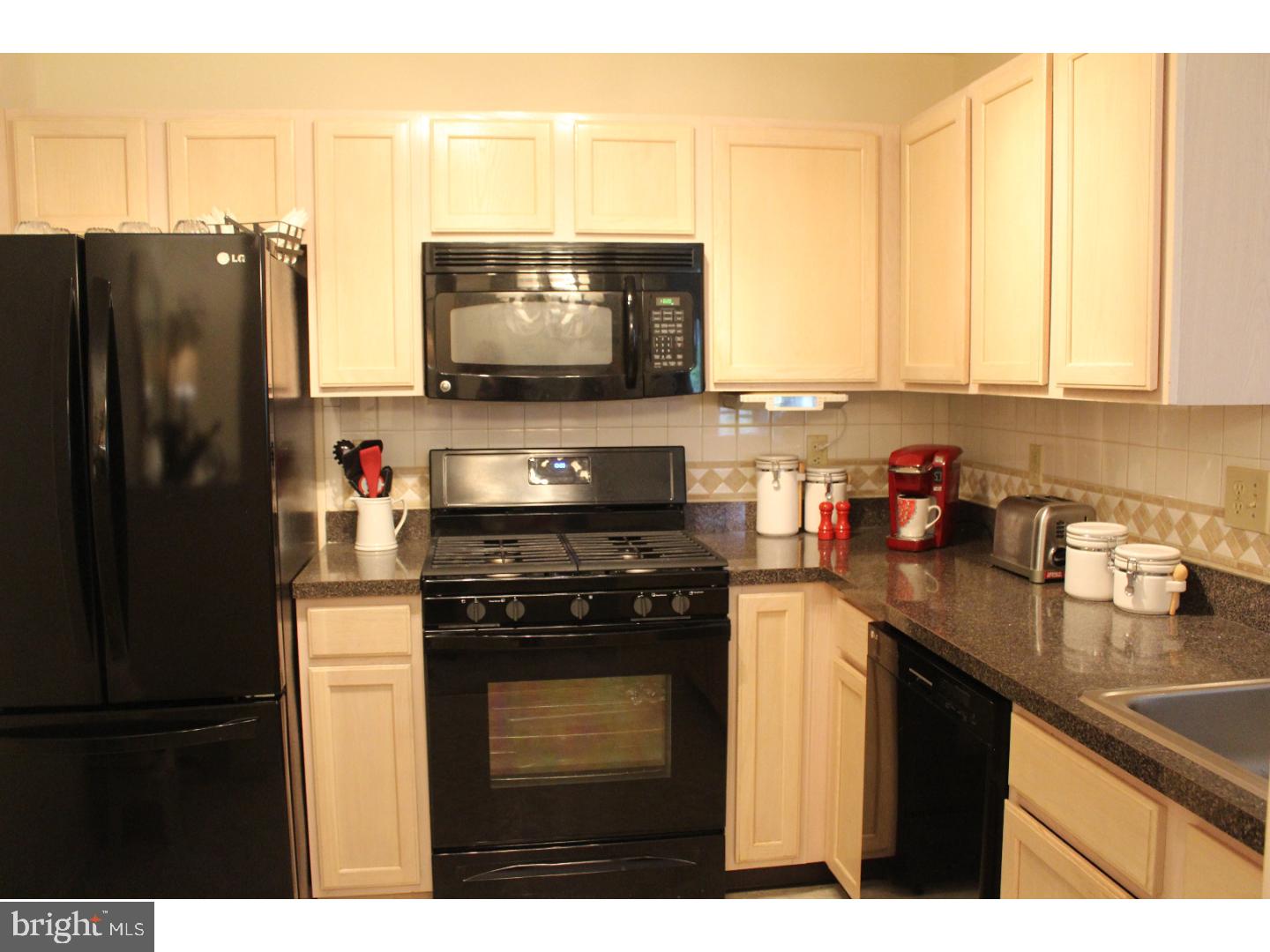 2005 Rabbit Run Road Marlton, NJ 08053 - Photo 2 of 17 a kitchen with a sink a stove and a refrigerator