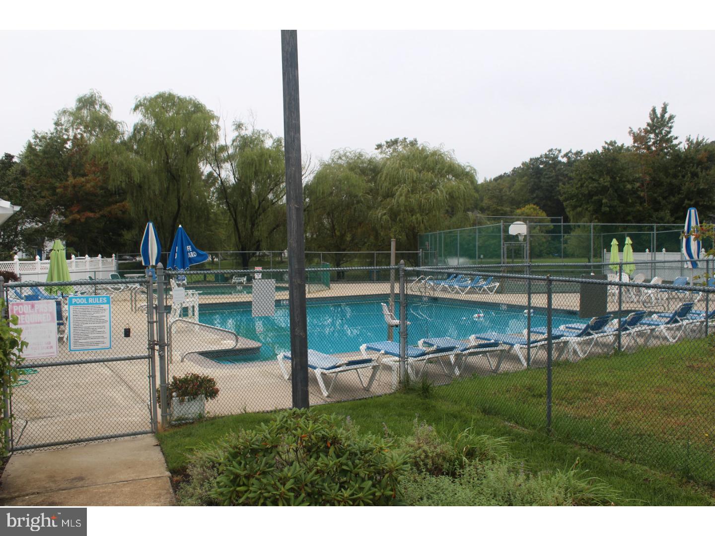 2005 Rabbit Run Road Marlton, NJ 08053 - Photo 11 of 17 a view of swimming pool with lawn chairs and iron fence