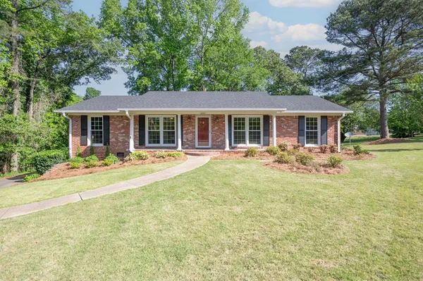 front view of a house with a yard