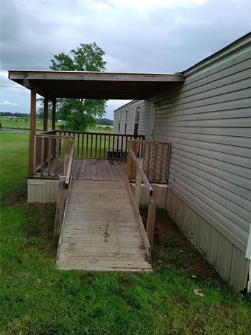 a view of balcony with wooden floor
