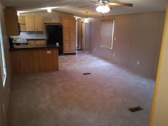 a view of a kitchen with a sink