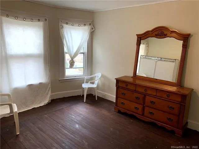 a room with chair and window