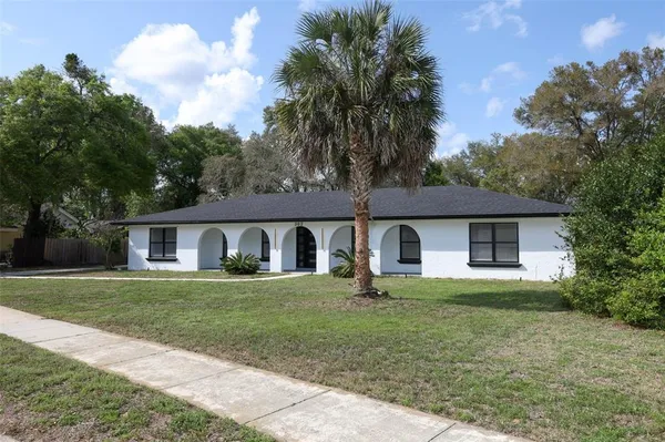 a view of kitchen and hall with wooden floor