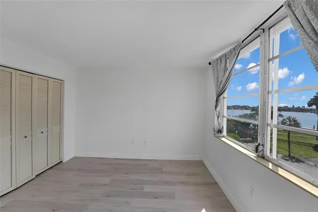 a view of an entryway with wooden floor