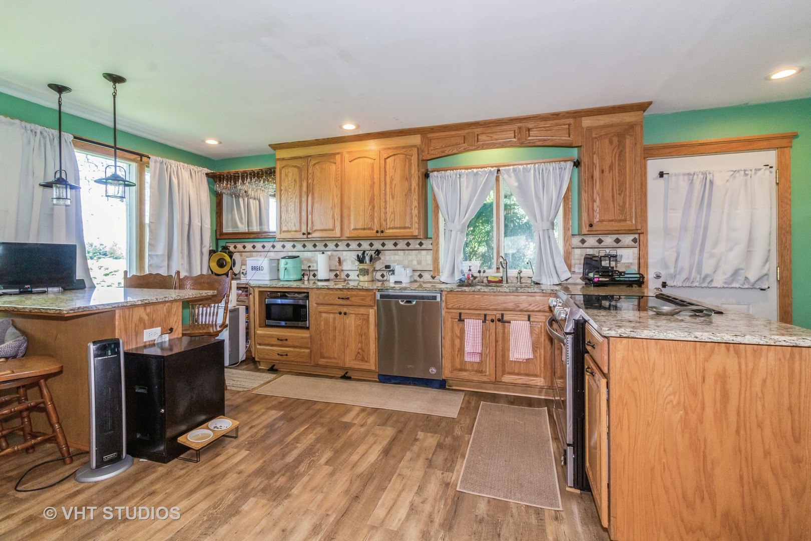 5S606 Davis Road Big Rock, IL 60511 - Photo 4 of 21 a kitchen with stainless steel appliances granite countertop a stove a sink dishwasher and a refrigerator with wooden floor