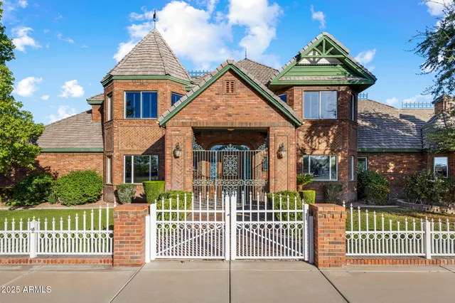 a view of a house with swimming pool and sitting area