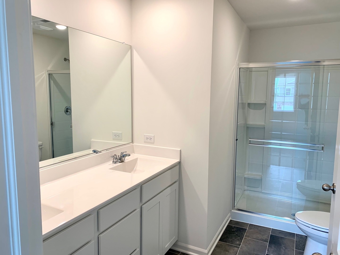 786 Westbury Drive Cary, IL 60013 - Photo 16 of 31 a bathroom with a sink and a mirror