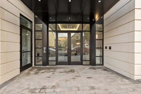 a view of a glass entrance door and windows