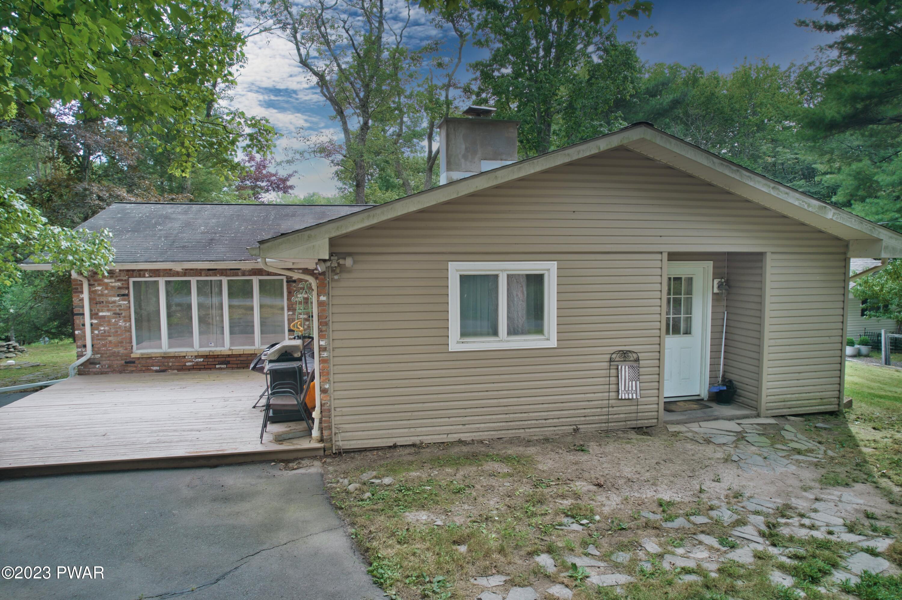 149 Walker Lake Road Shohola, PA 18458 - Photo 20 of 51 a view of a house with a yard