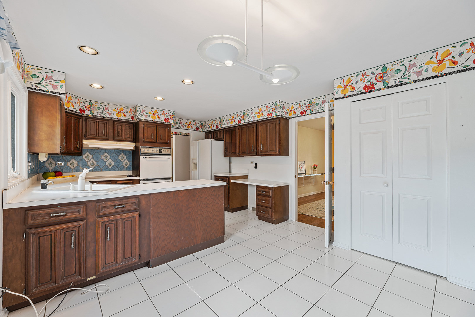 3210 Old Mill Road Northbrook, IL 60062 - Photo 14 of 41 a kitchen with refrigerator and cabinets