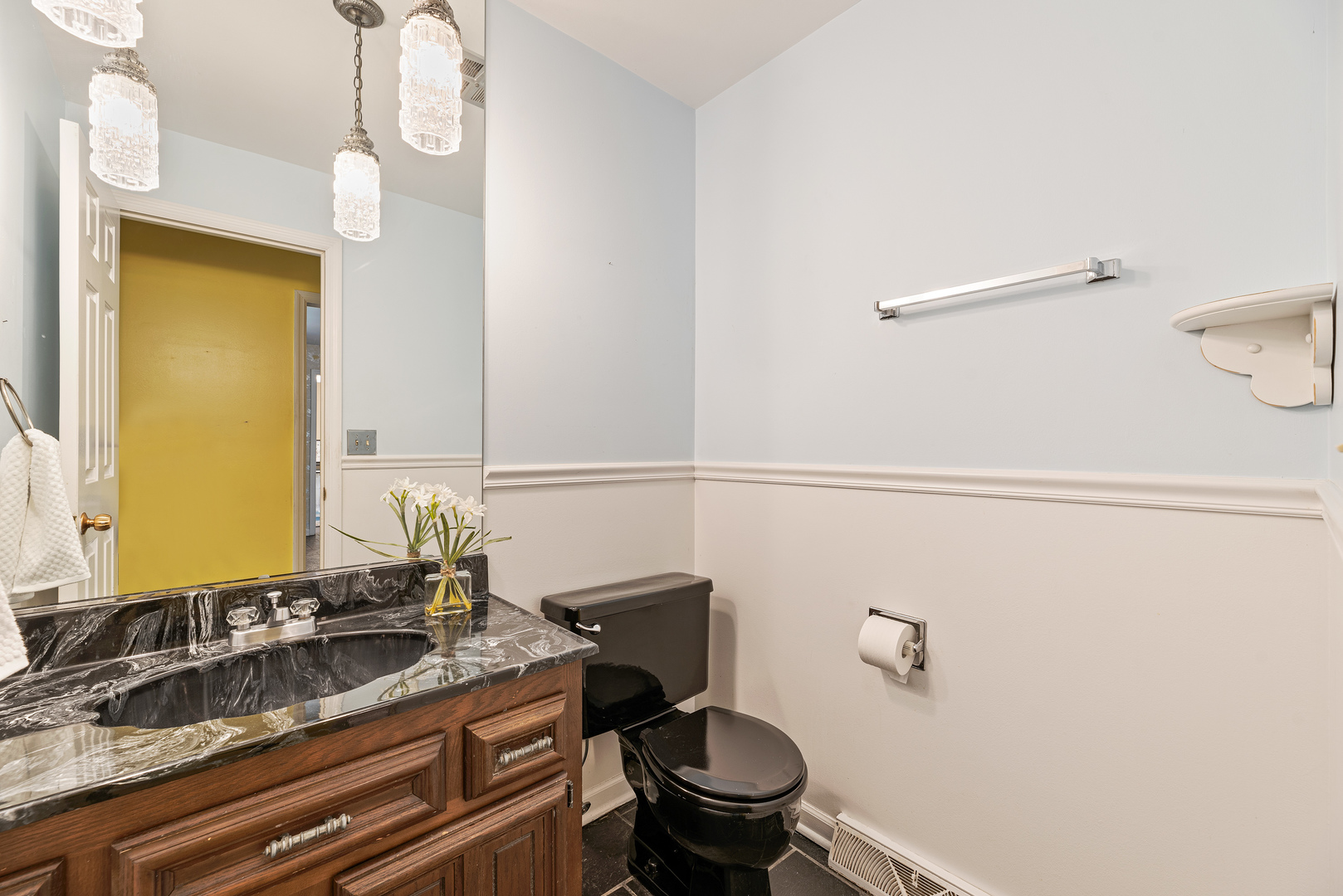 3210 Old Mill Road Northbrook, IL 60062 - Photo 25 of 41 a bathroom with a granite countertop sink a toilet and a mirror