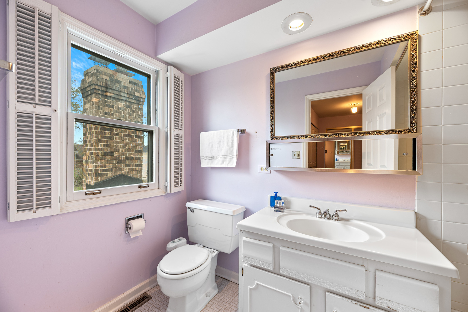 3210 Old Mill Road Northbrook, IL 60062 - Photo 28 of 41 a bathroom with a sink toilet and a window