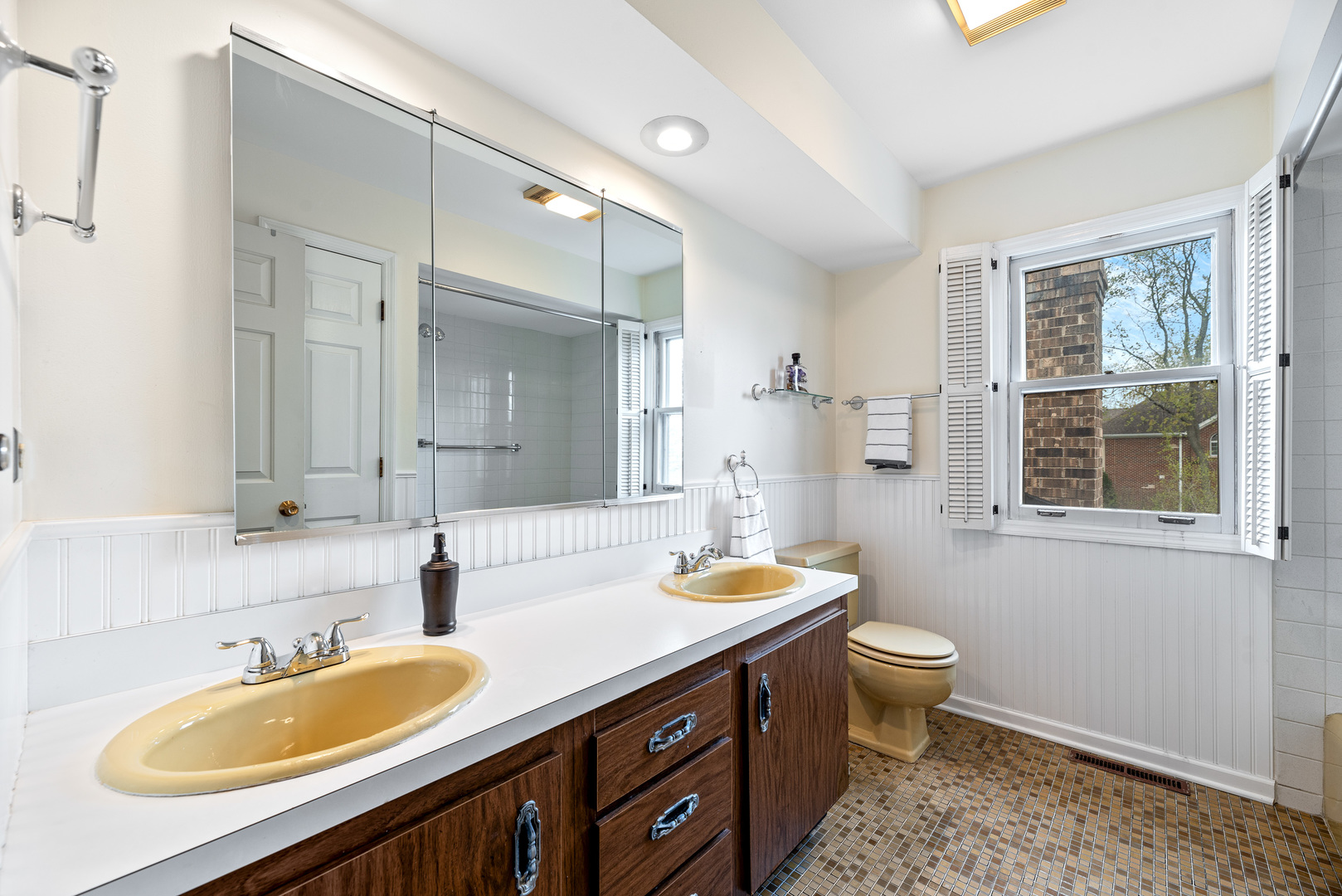 3210 Old Mill Road Northbrook, IL 60062 - Photo 30 of 41 a bathroom with a double vanity sink toilet mirror and shower