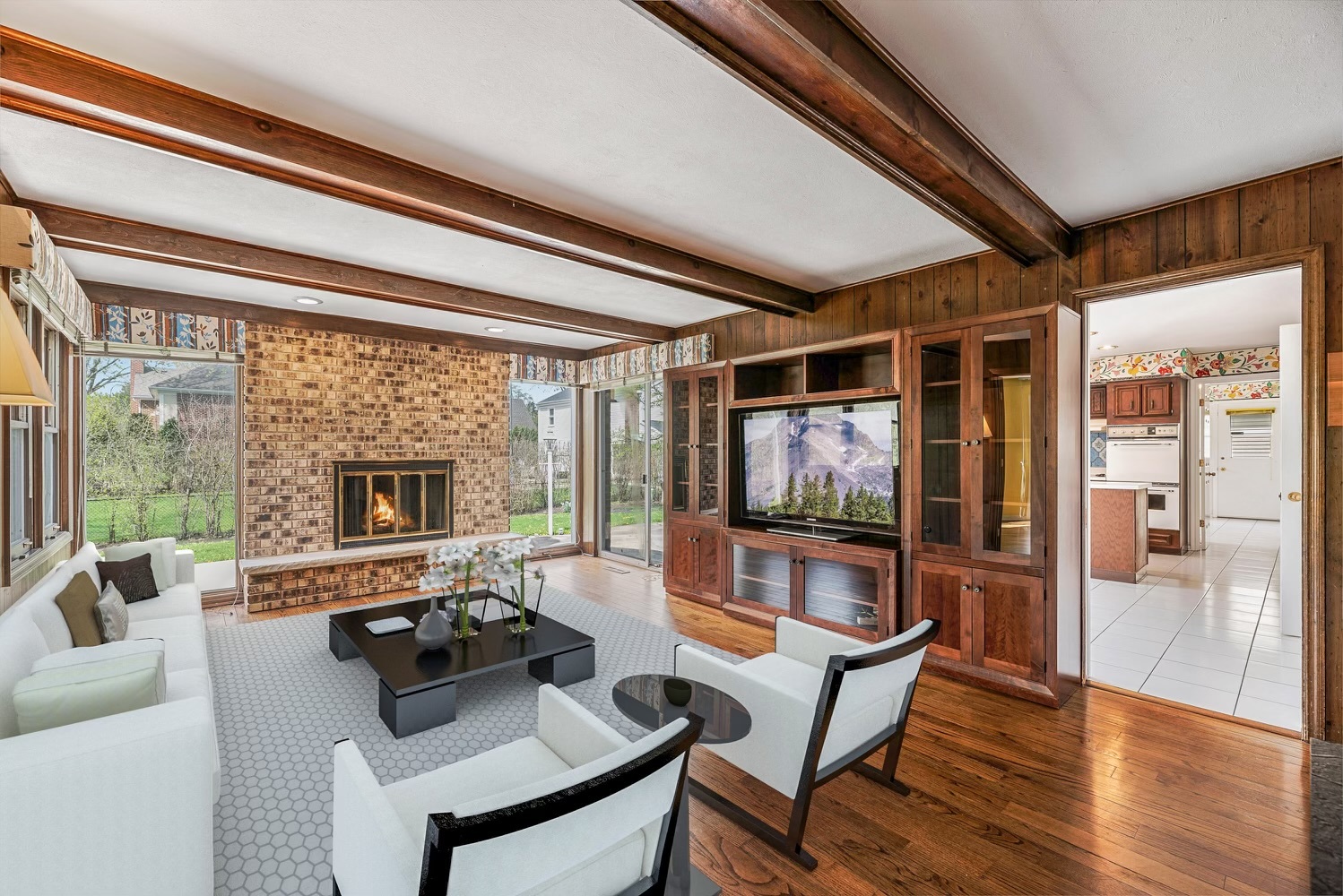 3210 Old Mill Road Northbrook, IL 60062 - Photo 5 of 41 a living room with furniture a flat screen tv and a floor to ceiling window