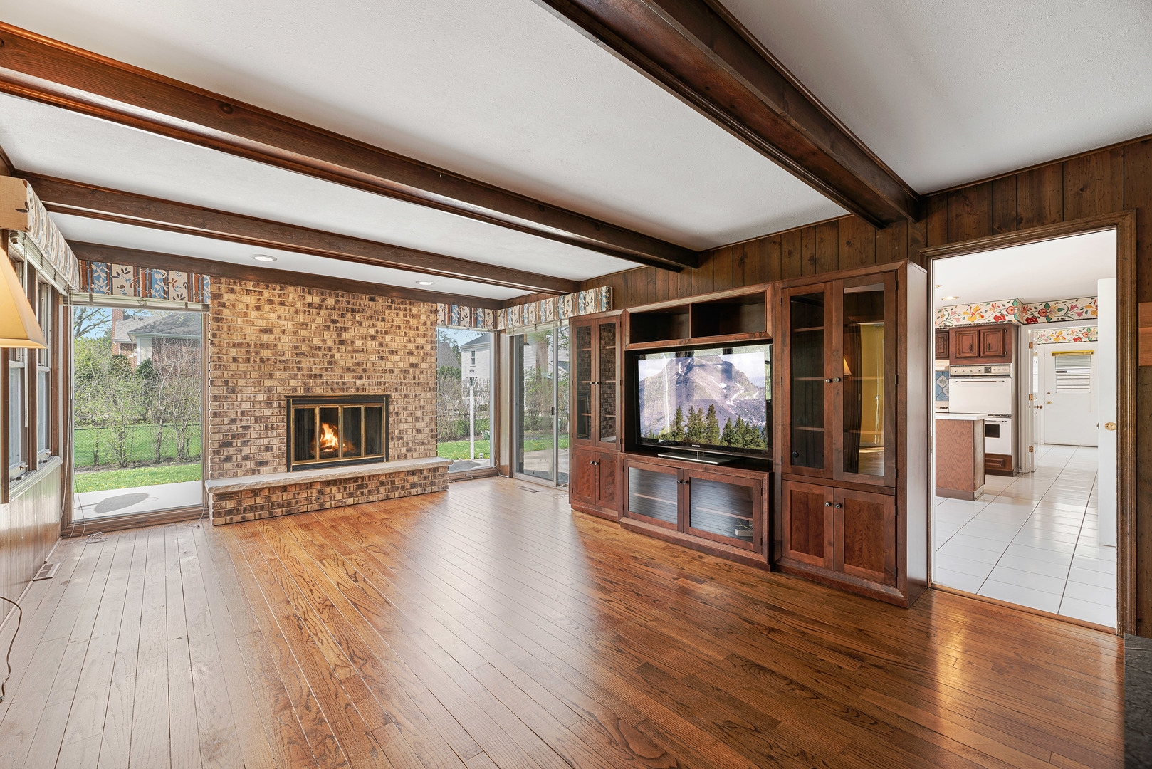3210 Old Mill Road Northbrook, IL 60062 - Photo 6 of 41 a view of a livingroom with wooden floor and a fireplace