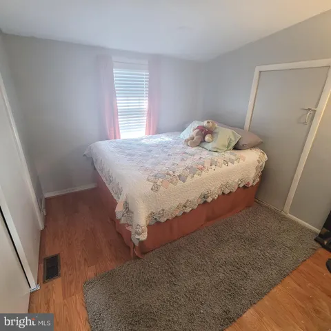 a bathroom with a sink toilet a mirror and vanity