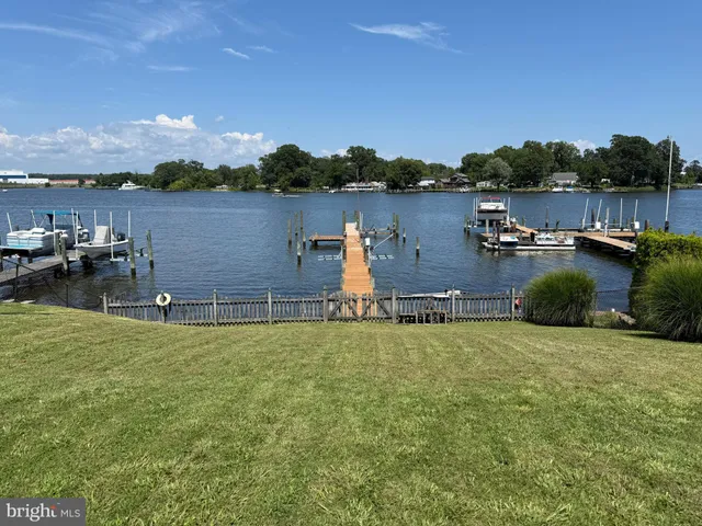 a front view of a house with outdoor seating