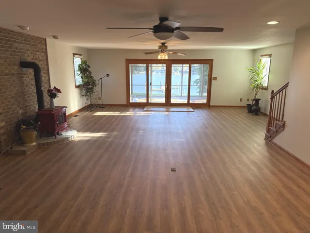 a view of livingroom with hardwood floor and a ceiling fan