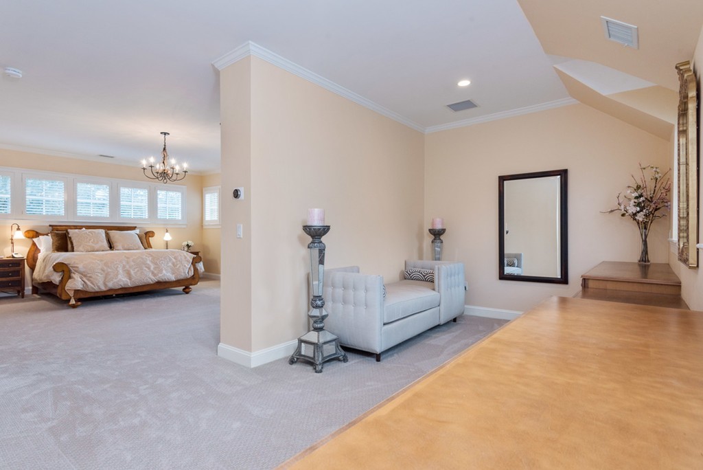 2 Stonegate Lane Dover, MA 02030 - Photo 17 of 28 a spacious bedroom with a bed and a couch