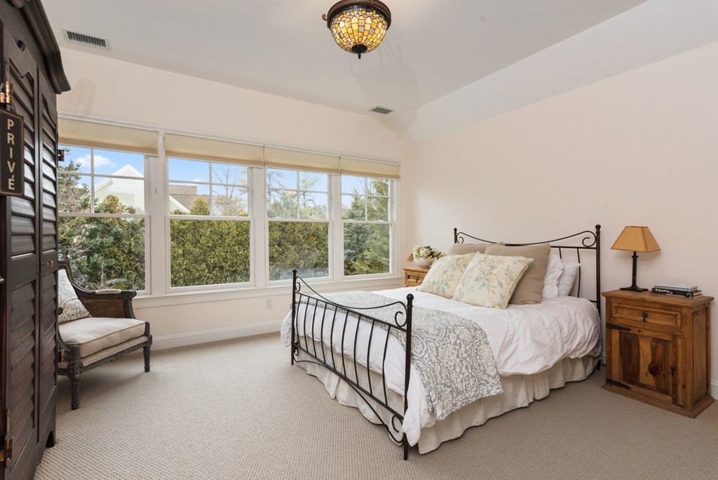 2 Stonegate Lane Dover, MA 02030 - Photo 20 of 28 a bedroom with a bed and a large window