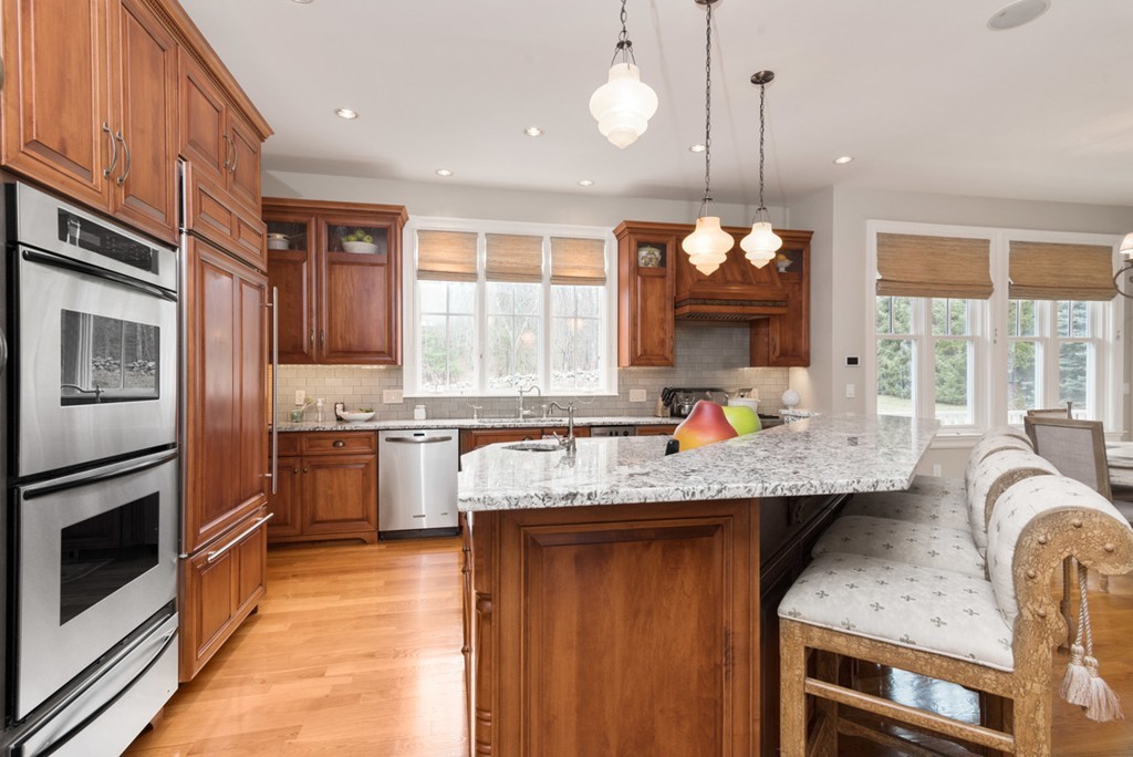 2 Stonegate Lane Dover, MA 02030 - Photo 10 of 28 a kitchen with stainless steel appliances granite countertop a sink stove and refrigerator