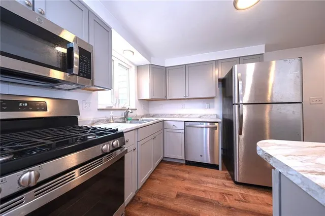a kitchen with a refrigerator stove and microwave