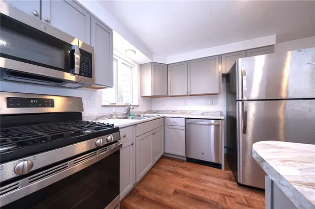 a kitchen with a refrigerator stove and microwave