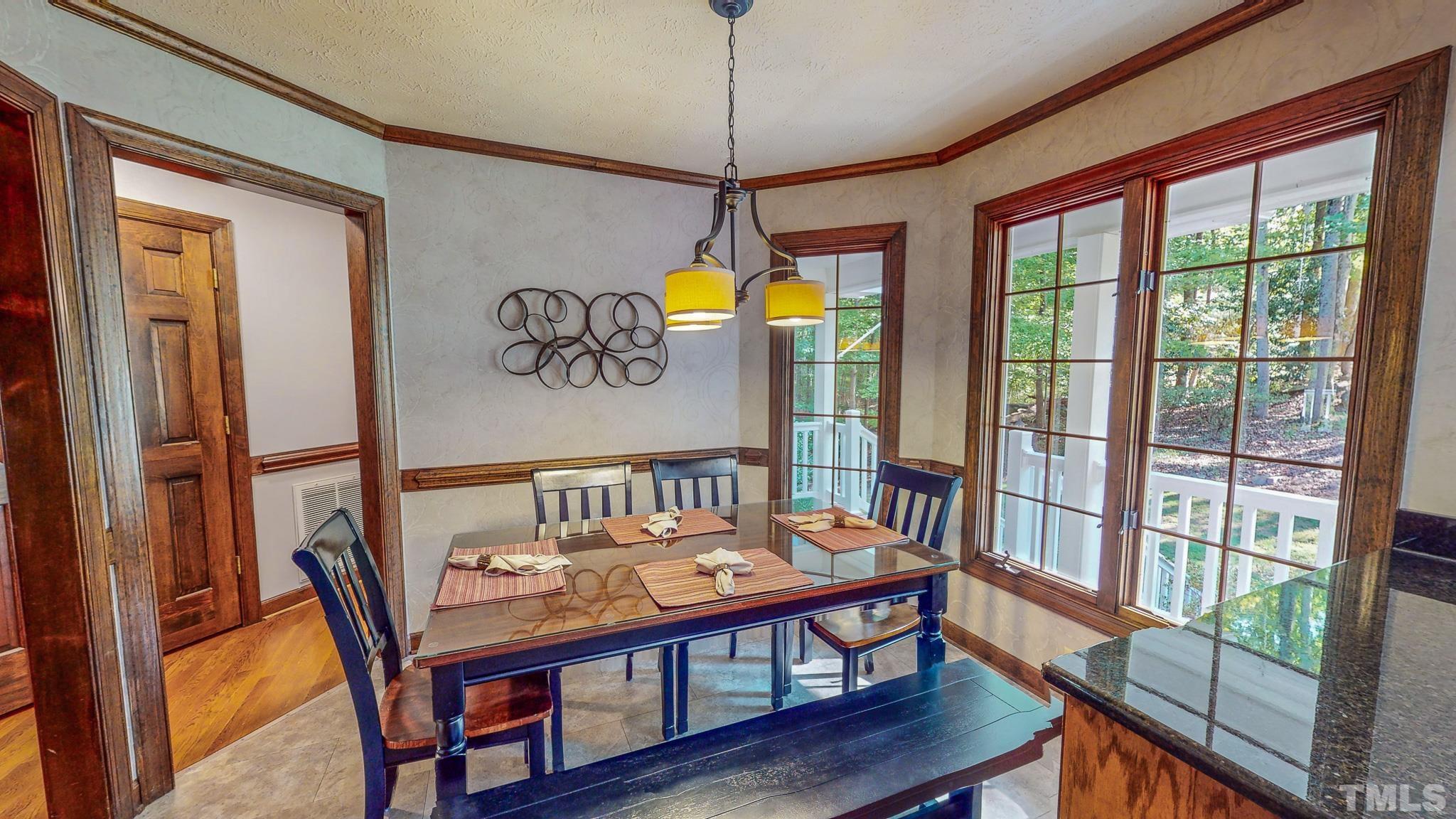 415 North Ridge Circle Roxboro, NC 27574 - Photo 18 of 59 a view of a dining room with furniture window and wooden floor