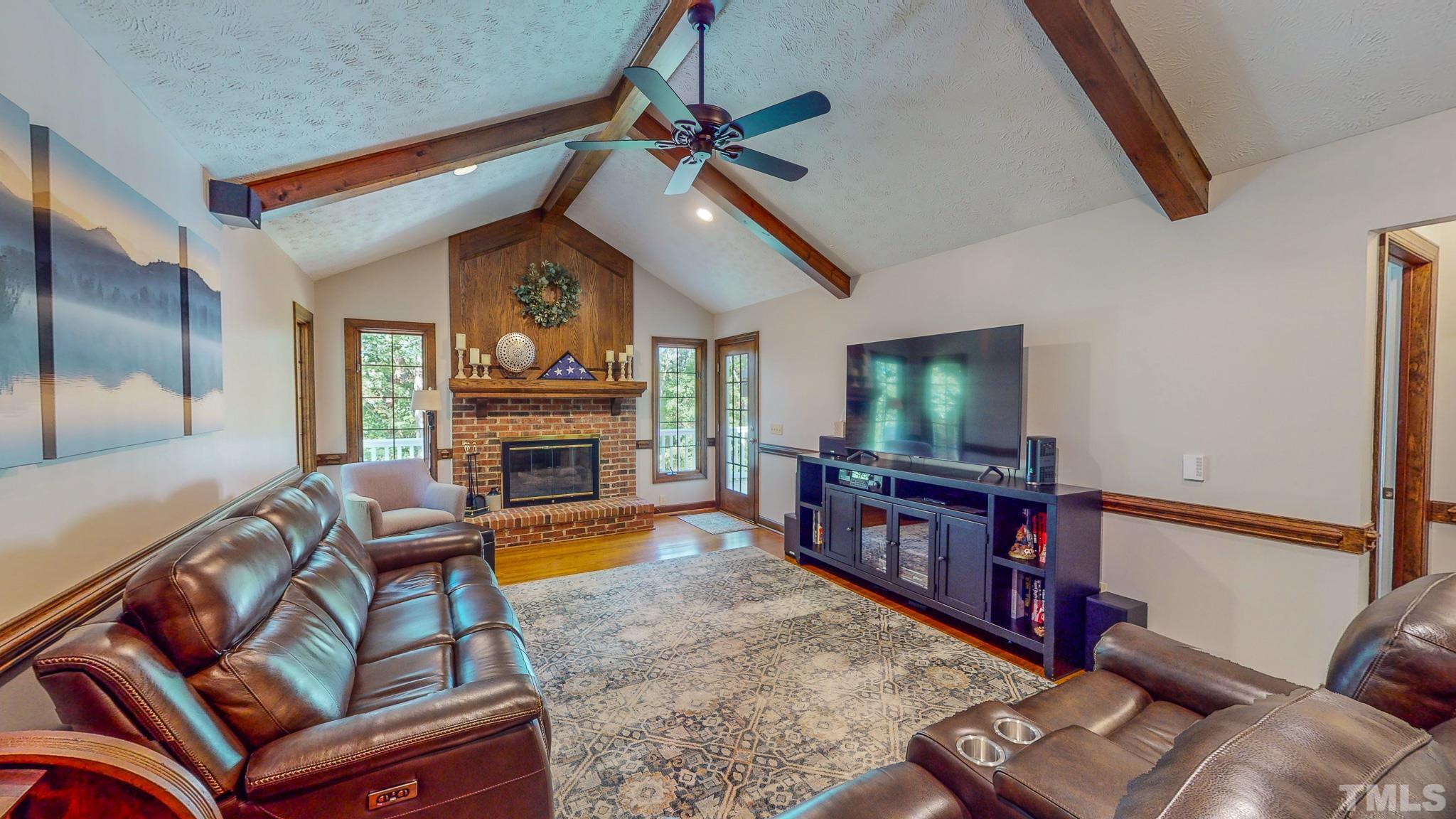 415 North Ridge Circle Roxboro, NC 27574 - Photo 2 of 59 a living room with furniture and a flat screen tv