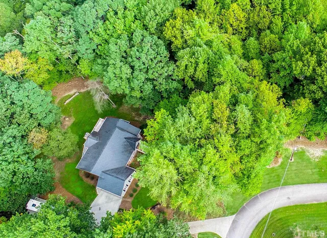 a view of a backyard with a small cabin