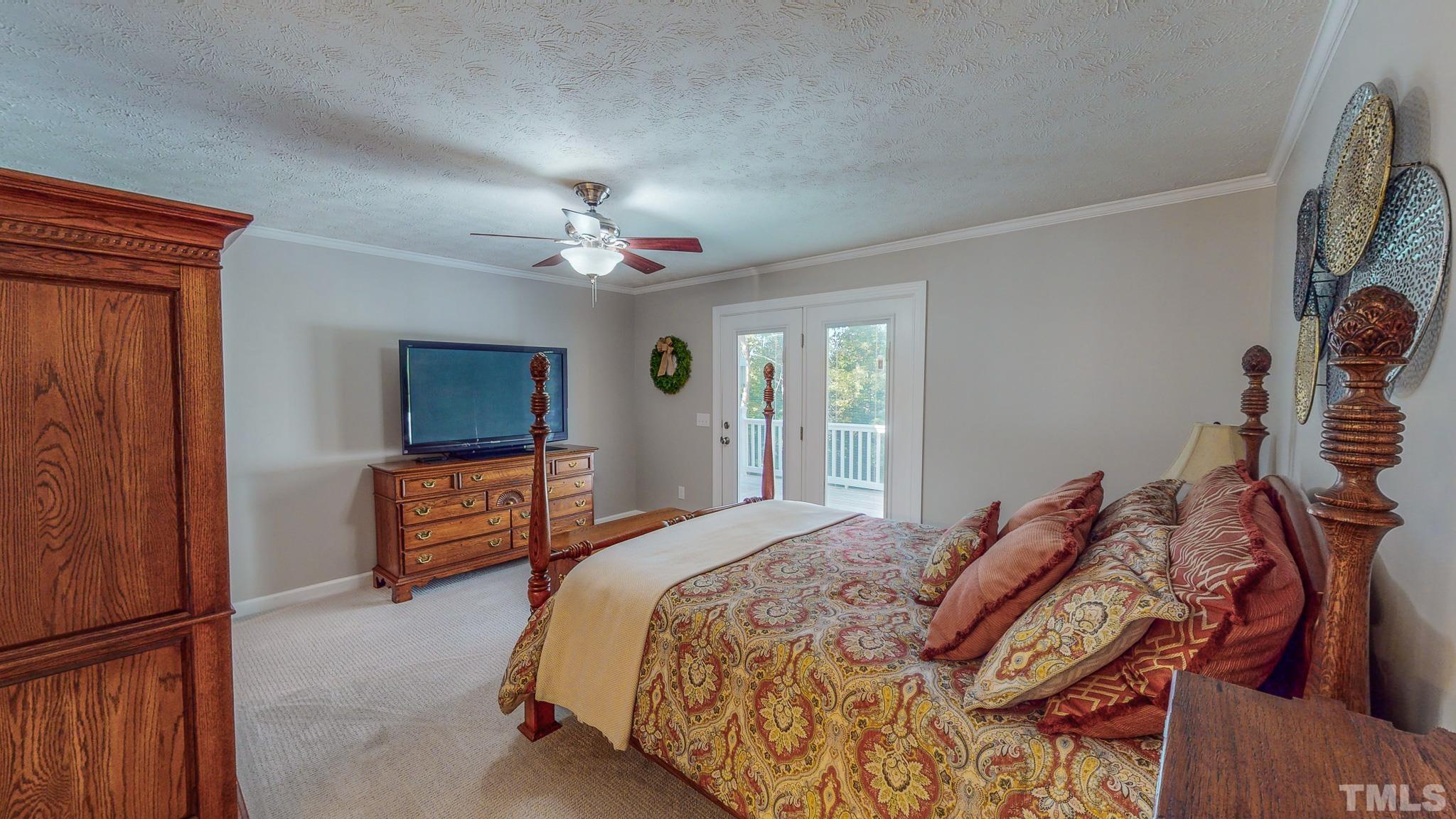 415 North Ridge Circle Roxboro, NC 27574 - Photo 29 of 59 a bedroom with a bed and a flat screen tv