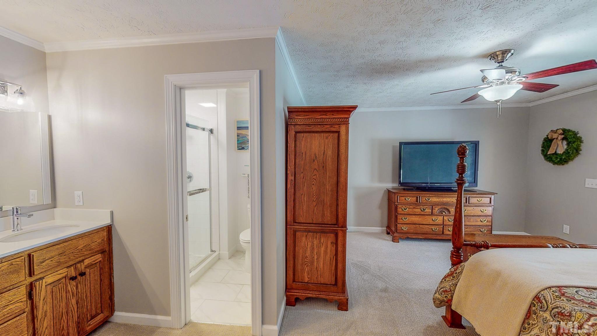 415 North Ridge Circle Roxboro, NC 27574 - Photo 30 of 59 a bedroom with a bed and a dresser