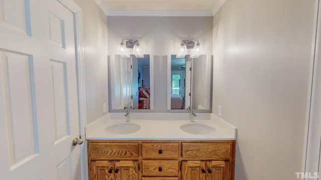 a view of a lush green forest with trees and some houses