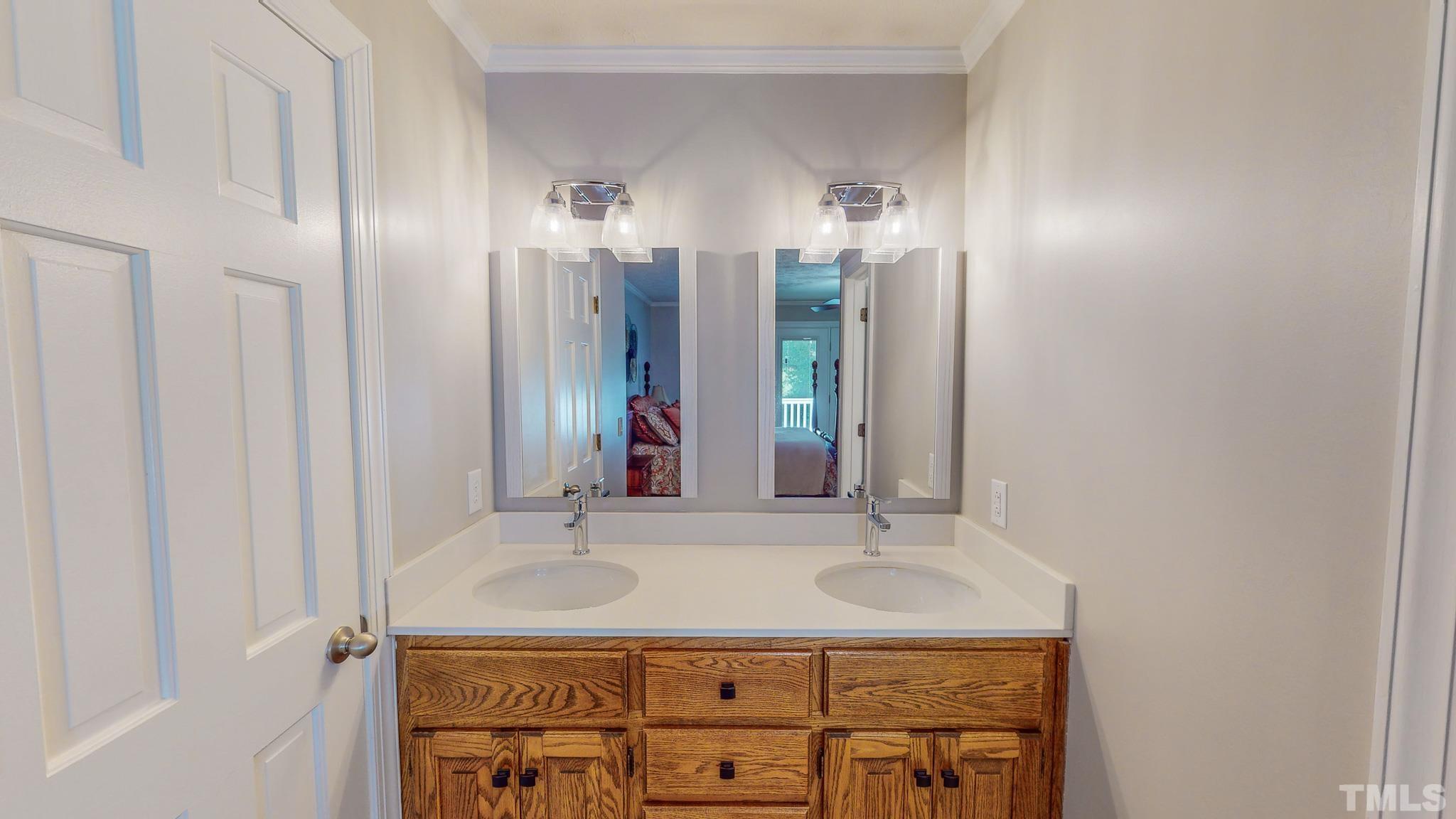 415 North Ridge Circle Roxboro, NC 27574 - Photo 31 of 59 a bathroom with a sink and a mirror