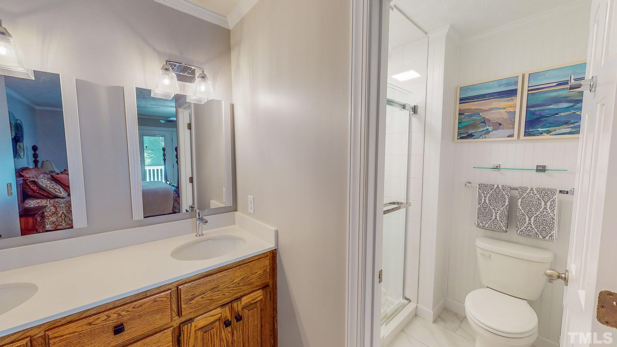415 North Ridge Circle Roxboro, NC 27574 - Photo 32 of 59 a bathroom with a granite countertop sink toilet and shower