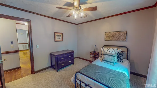 a bed room with a bed and a chandelier