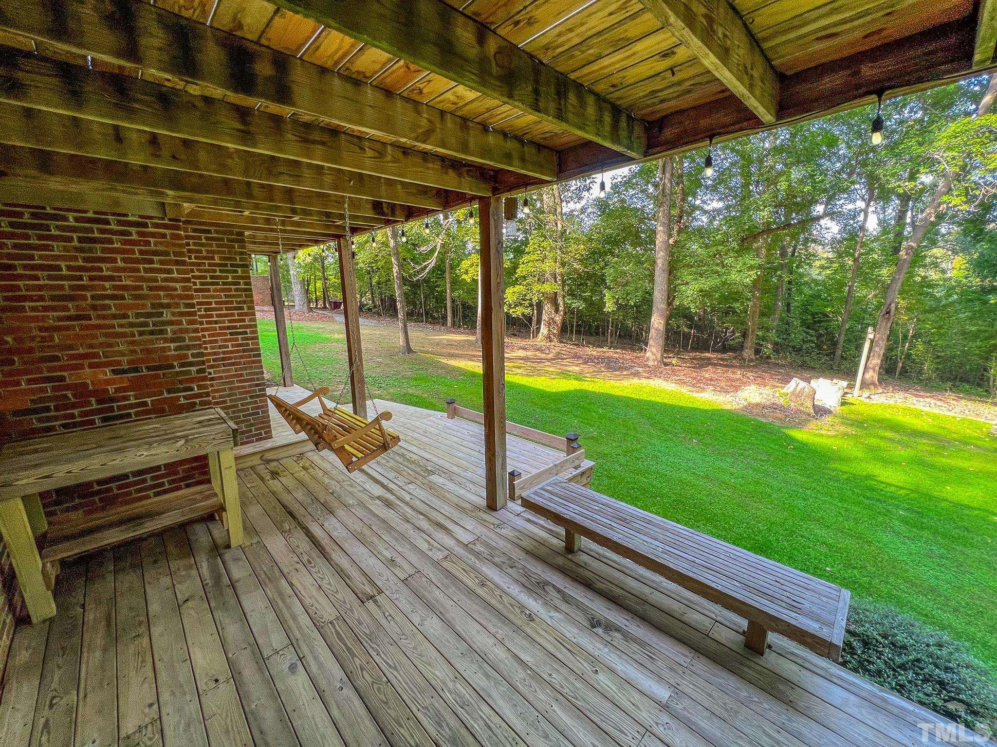 415 North Ridge Circle Roxboro, NC 27574 - Photo 7 of 59 a view of a patio with a table chairs and a patio