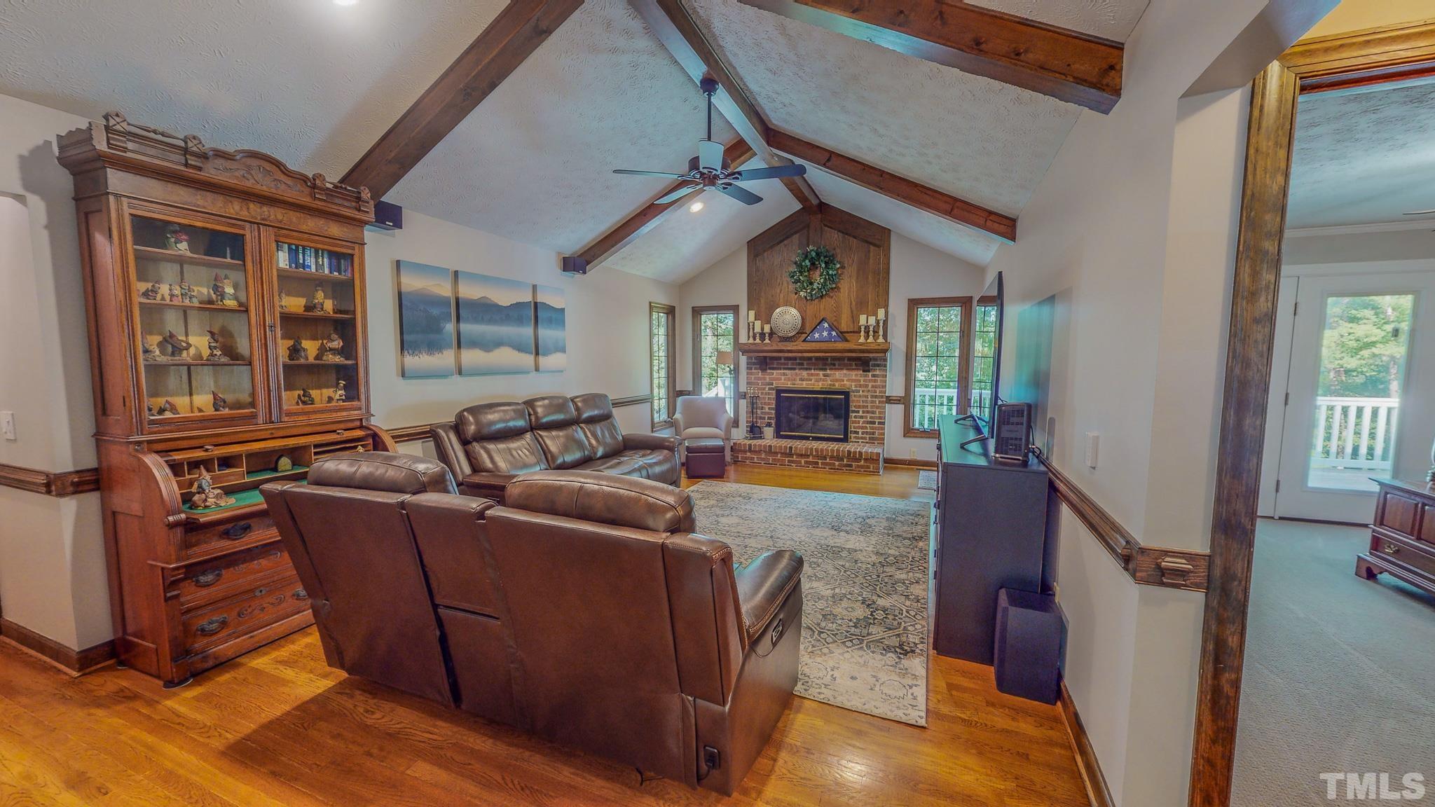 415 North Ridge Circle Roxboro, NC 27574 - Photo 9 of 59 a living room with furniture and a fireplace