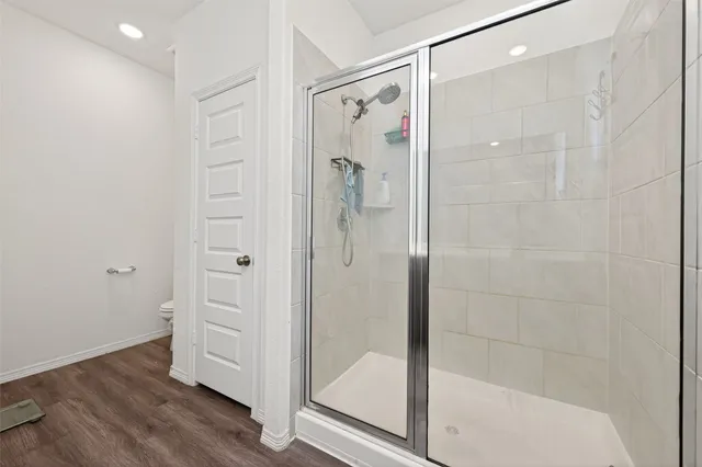 a bathroom with a glass shower door