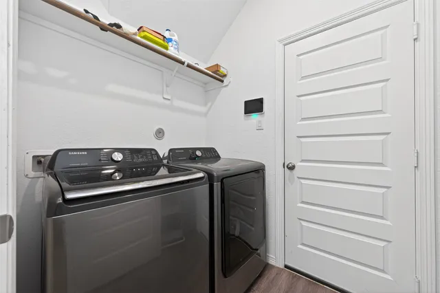 a utility room with dryer and washer