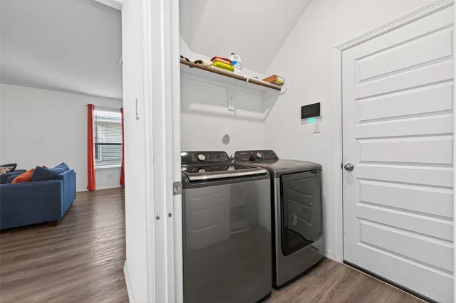 a kitchen with stainless steel appliances granite countertop a refrigerator and a stove
