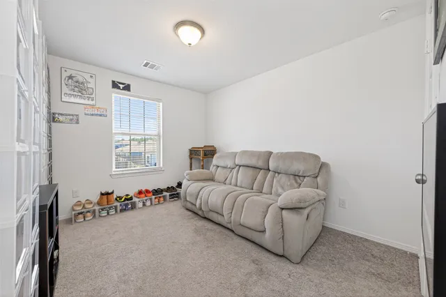 a living room with furniture and windows